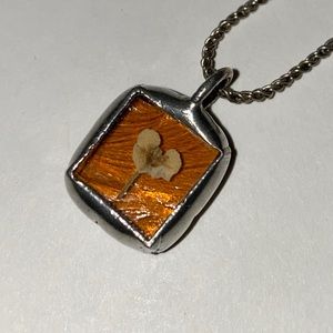 Hand made pendant/charm, chain  included. Pressed flower in amber resin.